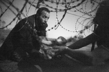 Migrants crossing the border from Serbia into Hungary.